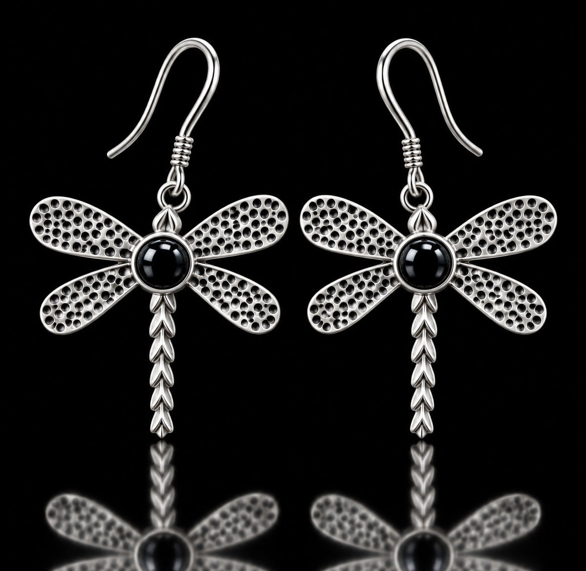 Sterling silver dragonfly earrings with textured wings and black onyx centers on French hooks. Item 894404.