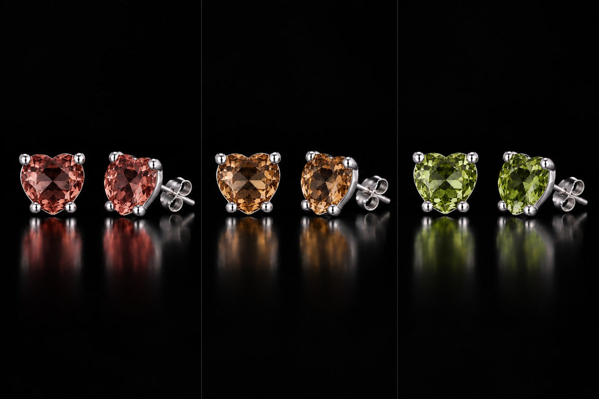 All three colors of the one pair of VooDooStone heart-cut studs side by side: purplish-pink daylight, golden amber incandescent, peridot green fluorescent. Item 894788.
