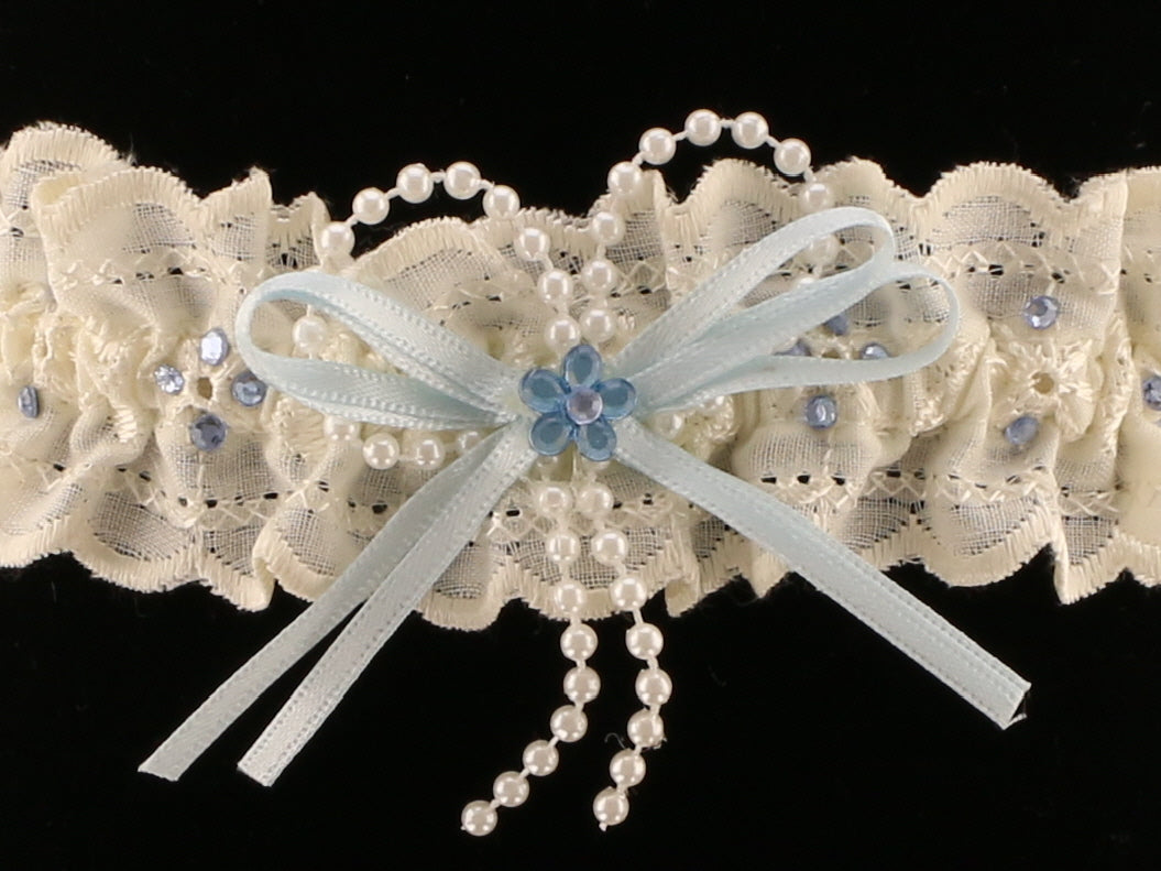 Sophisticated Elegance: Delicate Ivory Wedding Garter with Blue Satin Bow