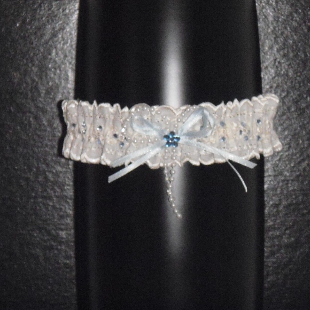 Sophisticated Elegance: Delicate Ivory Wedding Garter with Blue Satin Bow