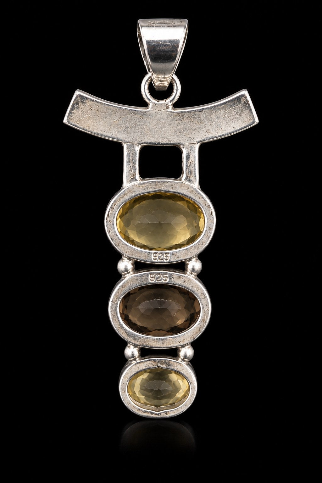 Sterling silver drop pendant with citrine, smoky quartz and citrine ovals under a curved bar, front view. Item 890265.