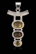 Sterling silver drop pendant with citrine, smoky quartz and citrine ovals under a curved bar, front view. Item 890265.