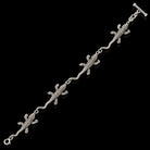Sterling silver lizard link bracelet with textured lizards and toggle clasp. Item 892662.