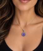 Purple filigree pendant worn on a model for scale. Item 894178.