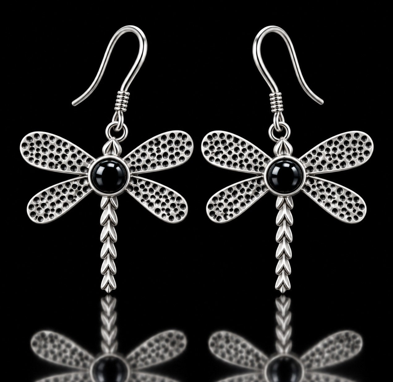 Sterling silver dragonfly earrings with textured wings and black onyx centers on French hooks. Item 894404.