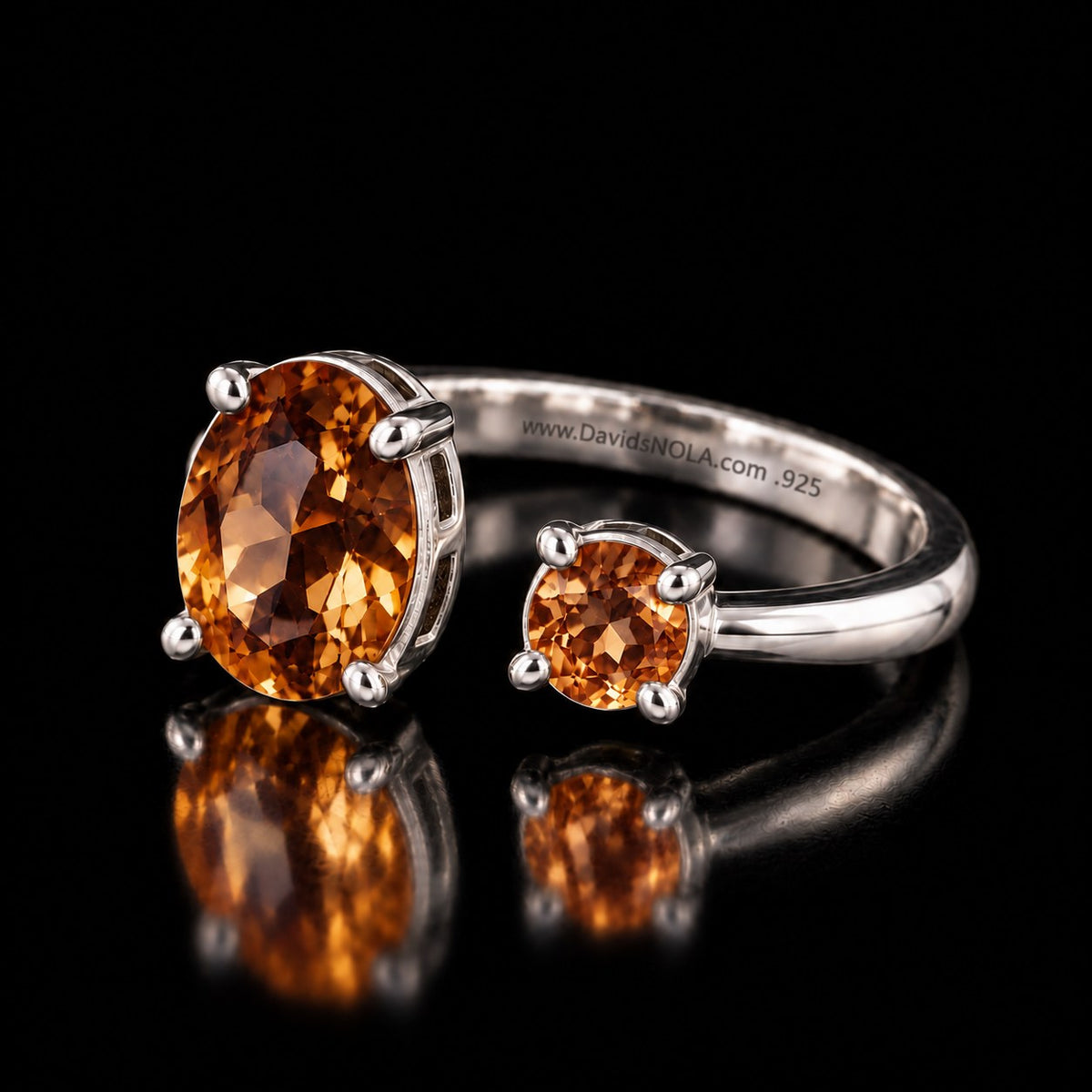 Sterling silver VooDooStone open gap ring, golden amber stones, angled view of the engraved band