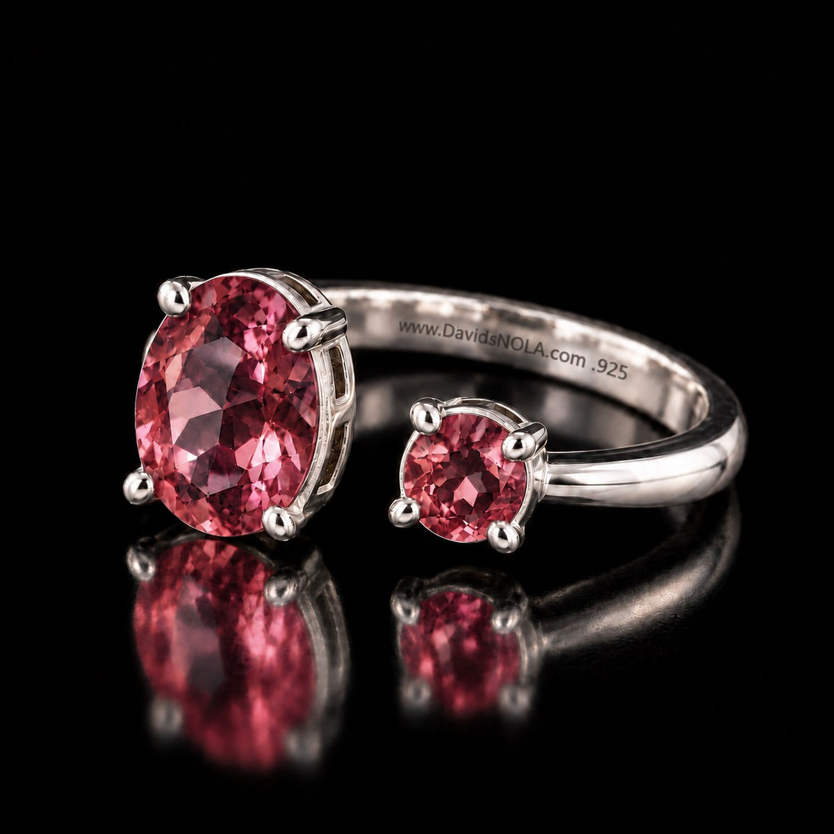 Sterling silver VooDooStone open gap ring, purplish-pink stones, angled view showing the open band