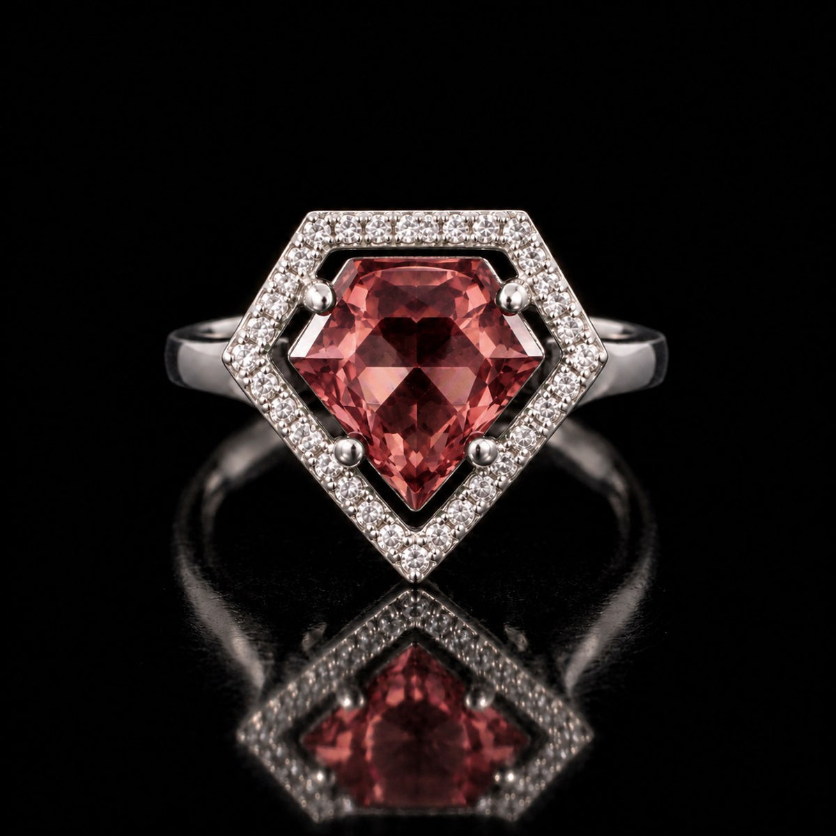 Sterling silver VooDooStone shield-cut halo ring, center stone purplish-pink in daylight inside a white pave halo, front view. Item 894784.