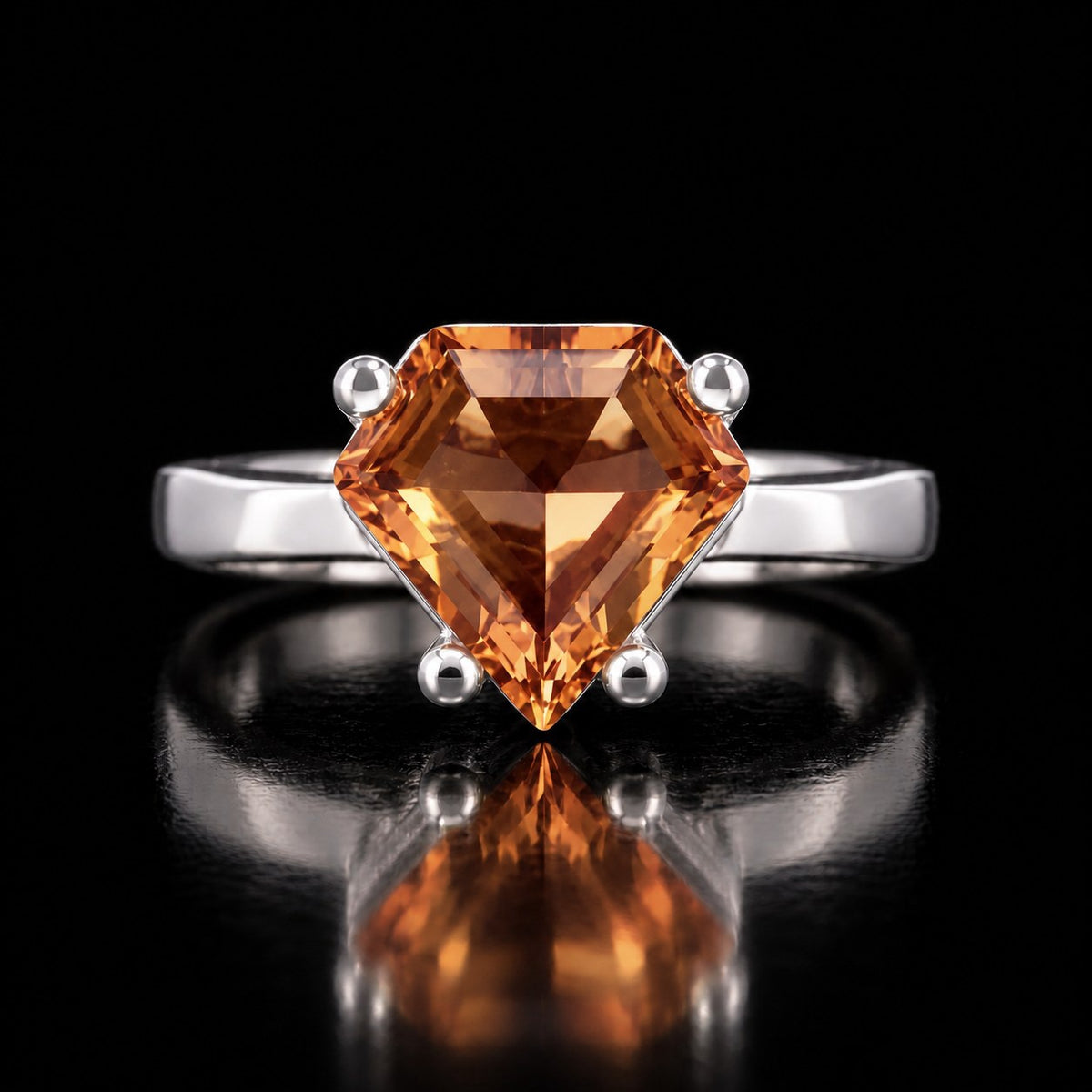 The same VooDooStone ring turning golden amber under warm incandescent light, front view. Item 894787.