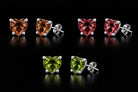 The VooDooStone heart-cut stud earrings grouped to compare the daylight, incandescent and fluorescent colors. Item 894788.